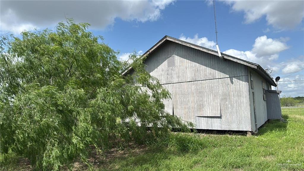 12427 Sasha Drive Santa Rosa, TX 78593 - Photo 17 of 17 a house with trees in the background
