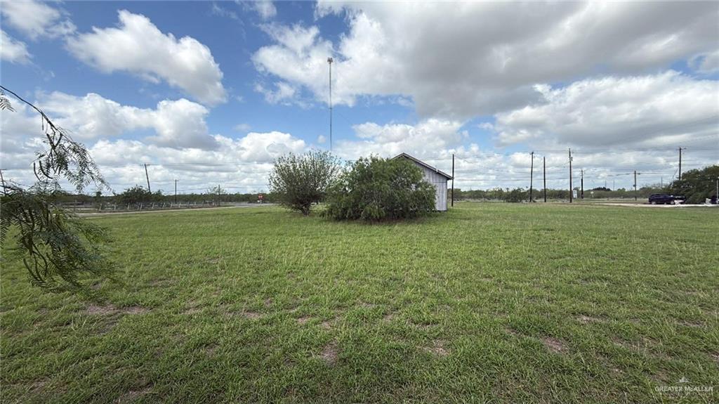 12427 Sasha Drive Santa Rosa, TX 78593 - Photo 2 of 17 a view of a big yard with a house