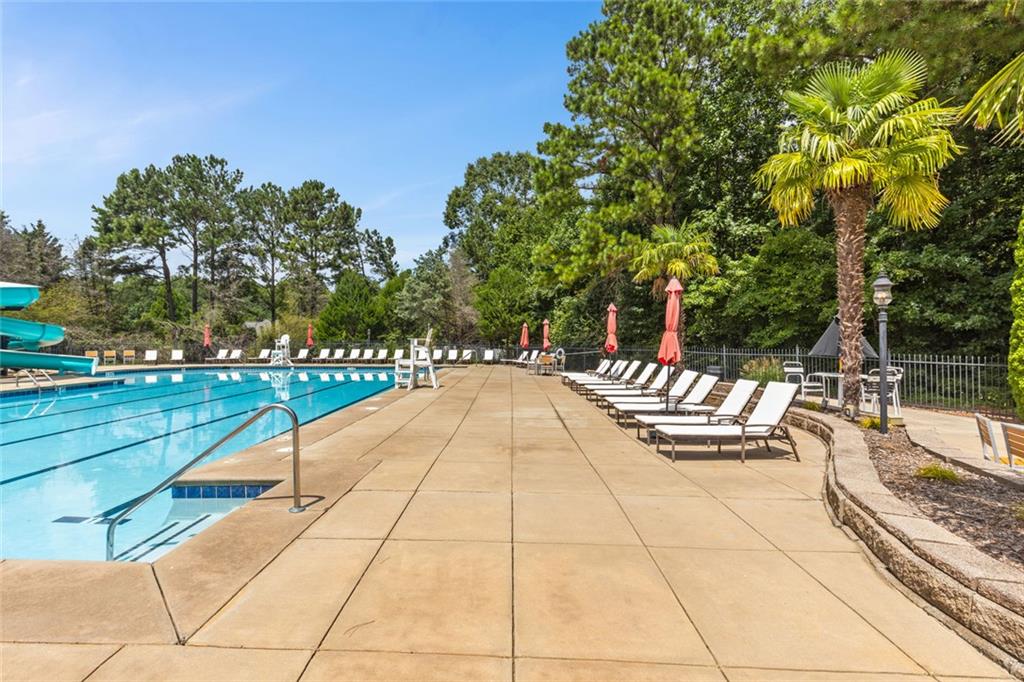 0 Marble Arch Way Flowery Branch, GA 30542 - Photo 13 of 24 a view of swimming pool with sitting area and slide
