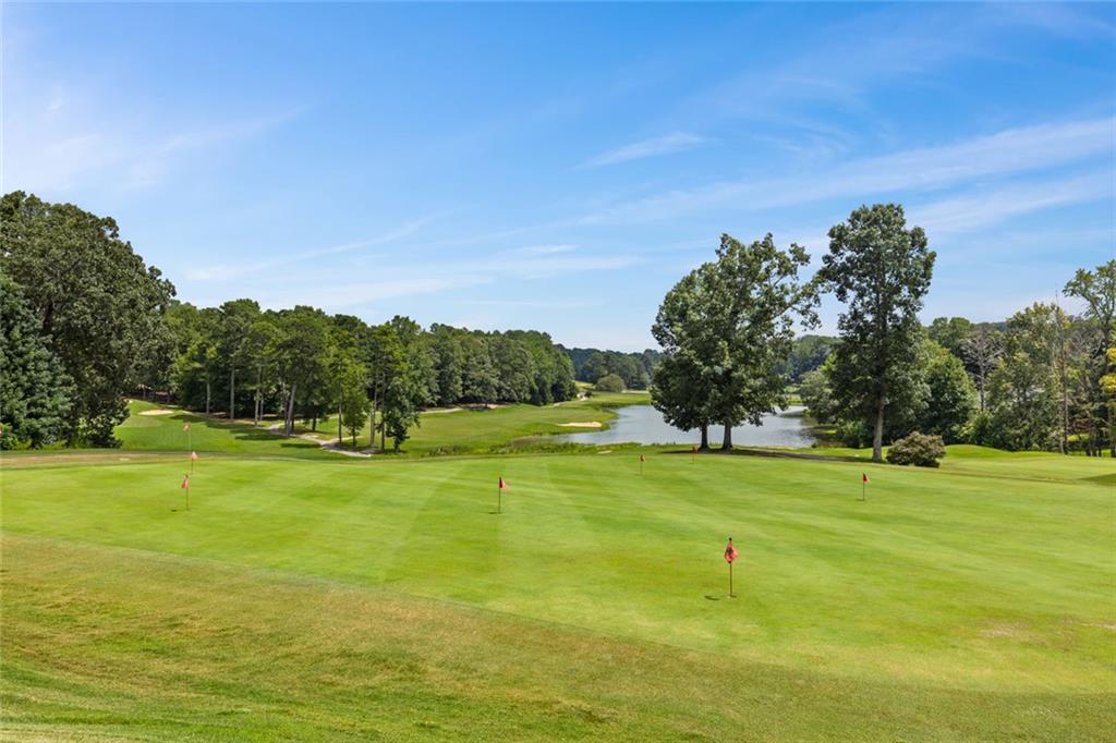 0 Marble Arch Way Flowery Branch, GA 30542 - Photo 19 of 24 a view of a big yard with an trees