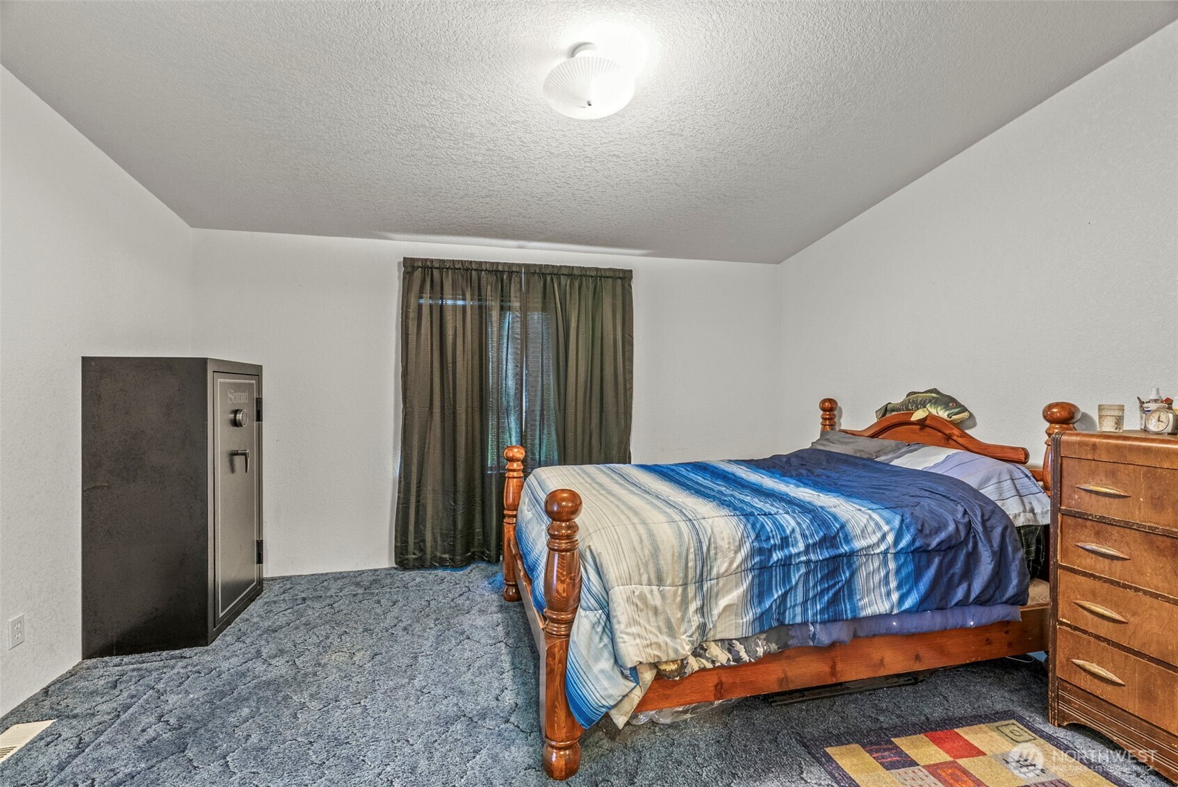 1337 South Silver Lake Road Castle Rock, WA 98611 - Photo 11 of 35 a bed sitting in a bedroom next to a window