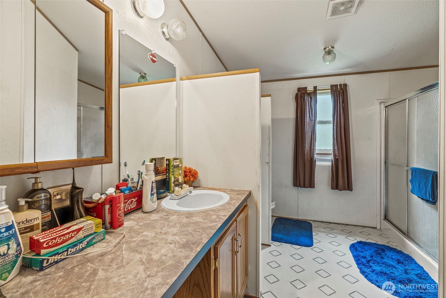 1337 South Silver Lake Road Castle Rock, WA 98611 - Photo 12 of 35 a kitchen with stainless steel appliances kitchen island granite countertop a sink and cabinets