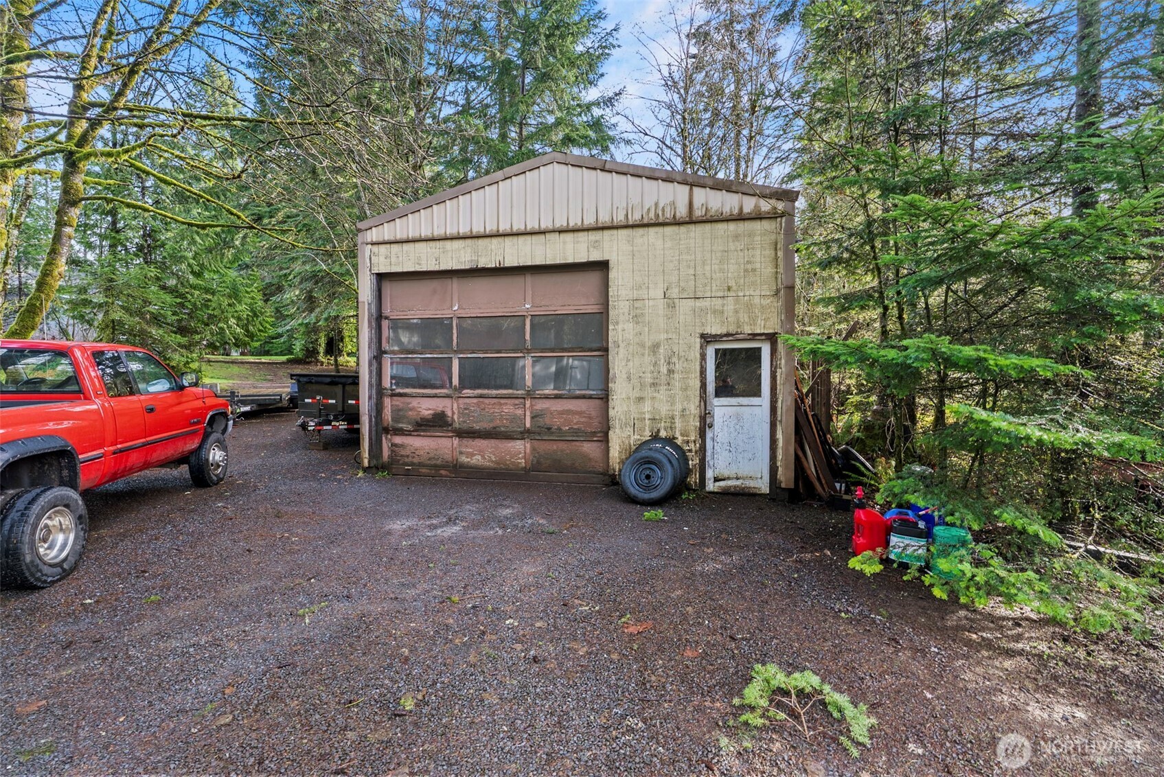 1337 South Silver Lake Road Castle Rock, WA 98611 - Photo 18 of 35 a view of a house with a yard and parking space