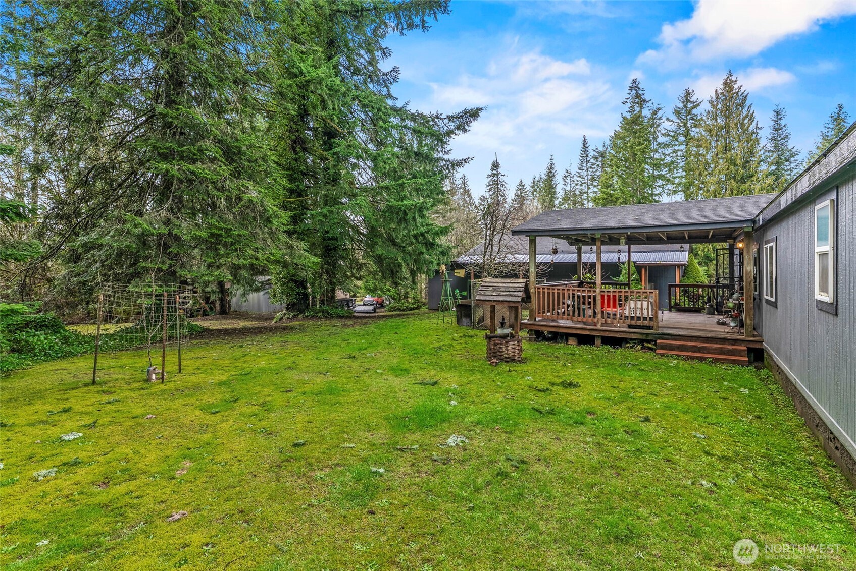 1337 South Silver Lake Road Castle Rock, WA 98611 - Photo 27 of 35 a view of a house with backyard and sitting area