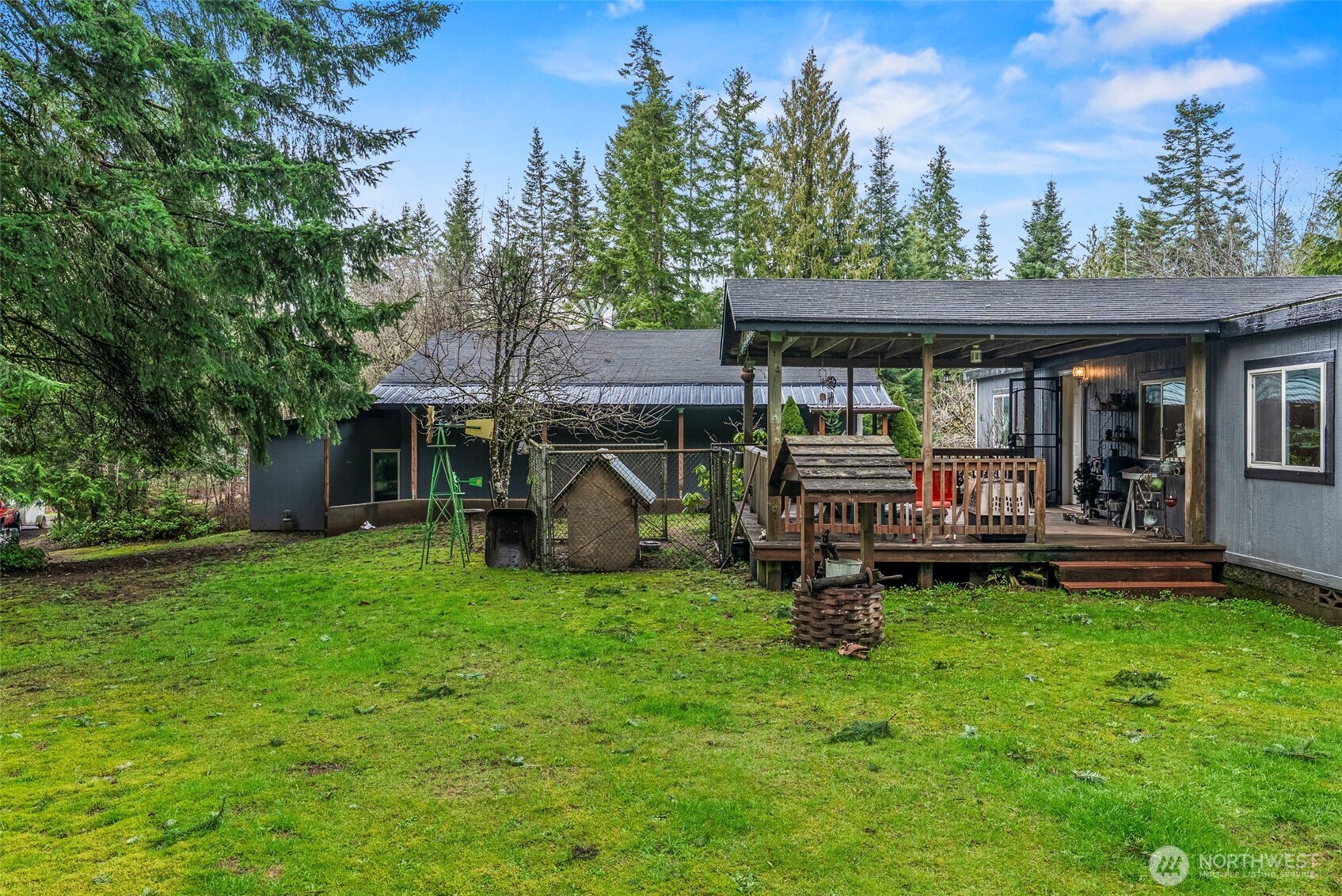 1337 South Silver Lake Road Castle Rock, WA 98611 - Photo 28 of 35 front view of a house with a yard table and chairs