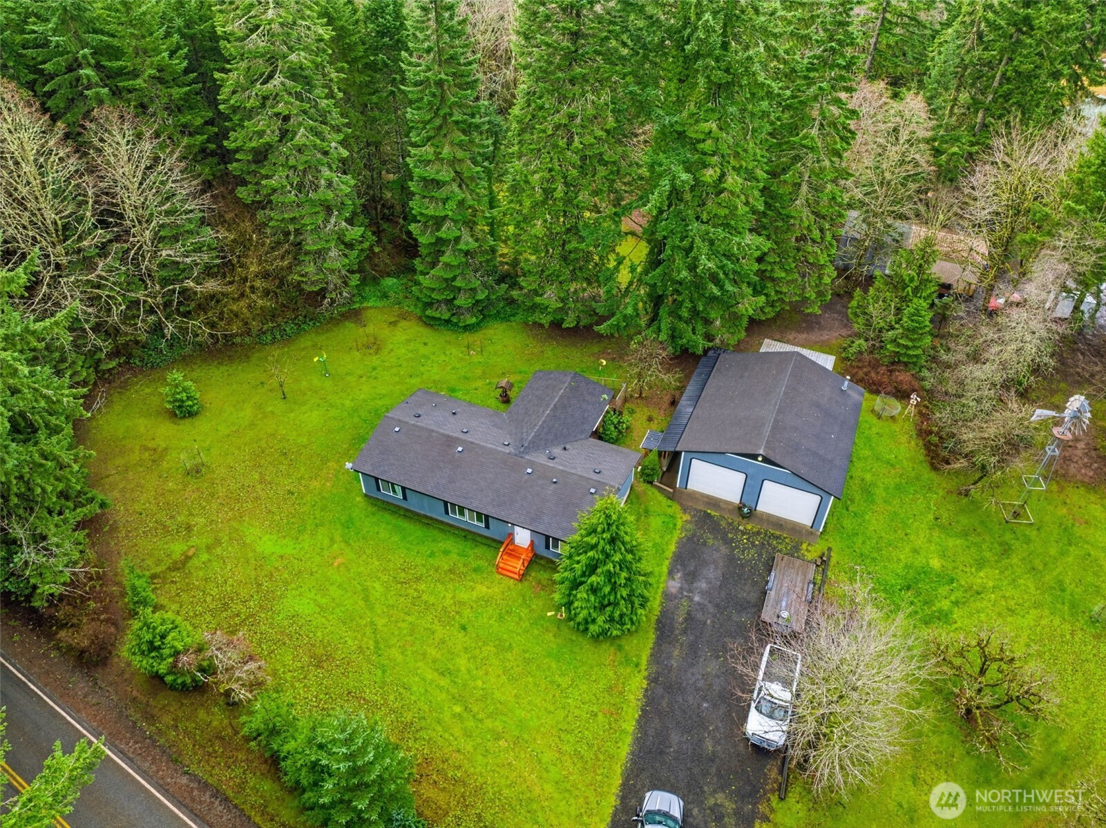 1337 South Silver Lake Road Castle Rock, WA 98611 - Photo 31 of 35 an aerial view of a house with garden space and street view