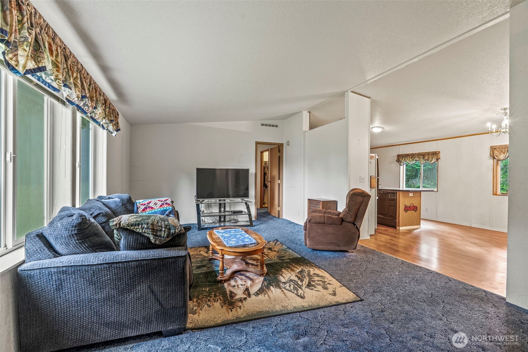 1337 South Silver Lake Road Castle Rock, WA 98611 - Photo 4 of 35 a living room with furniture and a flat screen tv
