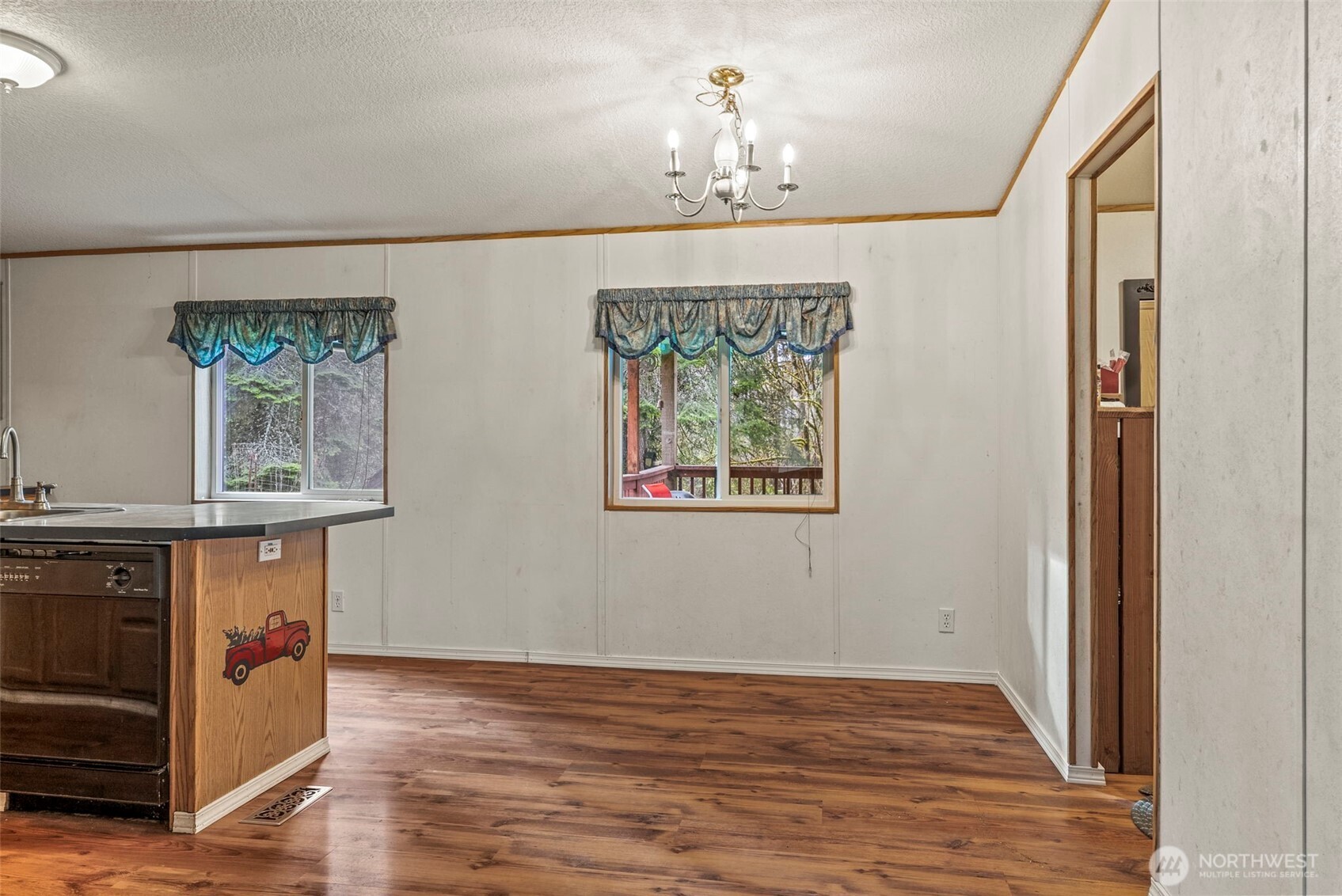 1337 South Silver Lake Road Castle Rock, WA 98611 - Photo 5 of 35 wooden floor in an empty room with a window