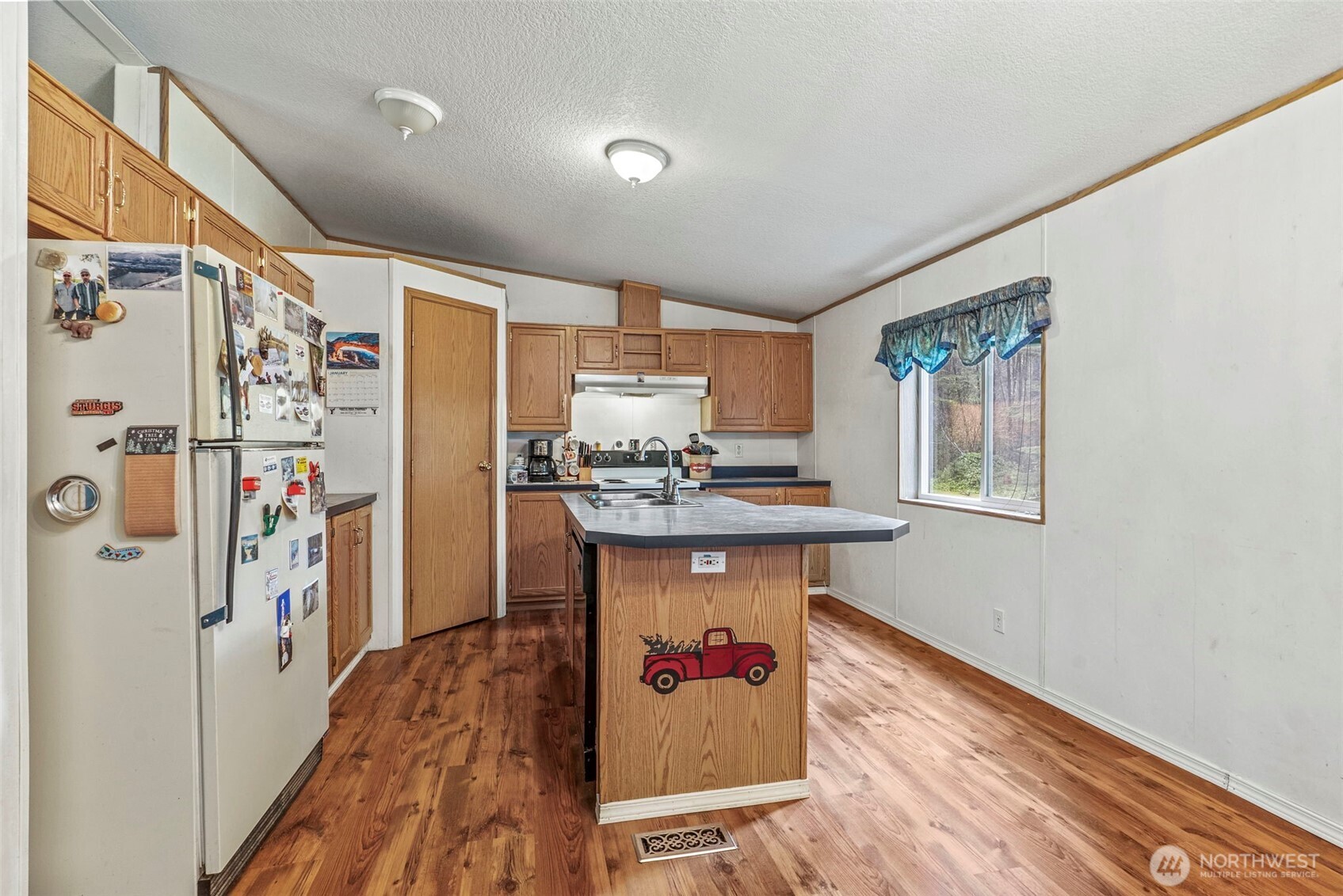 1337 South Silver Lake Road Castle Rock, WA 98611 - Photo 6 of 35 a kitchen with stainless steel appliances granite countertop a refrigerator and a sink