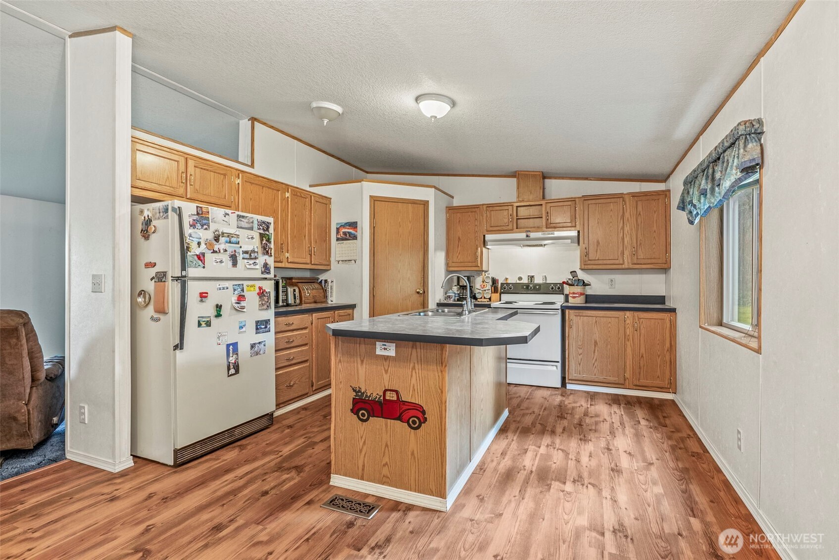 1337 South Silver Lake Road Castle Rock, WA 98611 - Photo 7 of 35 a kitchen with stainless steel appliances granite countertop a refrigerator and a stove top oven