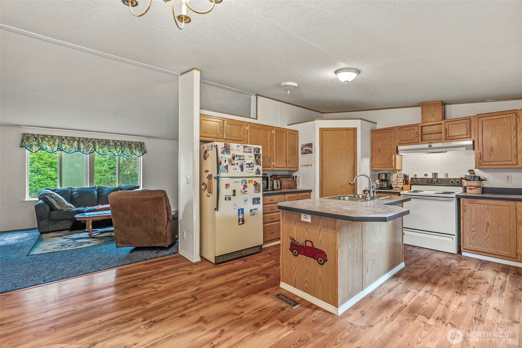 1337 South Silver Lake Road Castle Rock, WA 98611 - Photo 8 of 35 a kitchen with stainless steel appliances granite countertop a stove a sink and a refrigerator