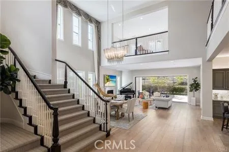 a view of entryway livingroom and hall with wooden floor