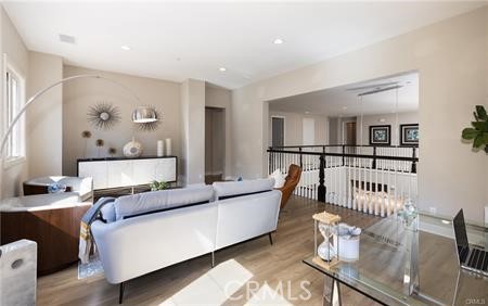 112 Gardenview Irvine, CA 92618 - Photo 18 of 33 a living room with furniture and wooden floor