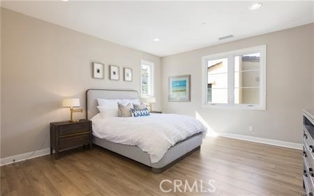 112 Gardenview Irvine, CA 92618 - Photo 19 of 33 a bedroom with a bed lamp and a window