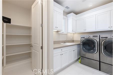 112 Gardenview Irvine, CA 92618 - Photo 21 of 33 a utility room with sink dryer and washer