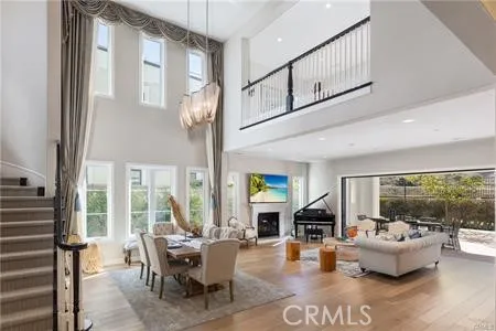 a living room with fireplace furniture and a large window