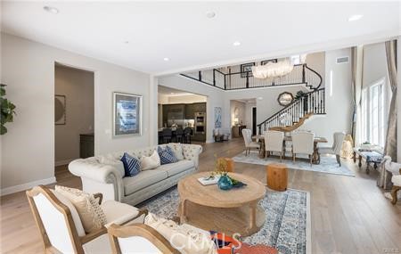 112 Gardenview Irvine, CA 92618 - Photo 6 of 33 a living room with furniture and wooden floor