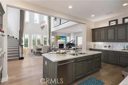 a kitchen with a sink stove and cabinets