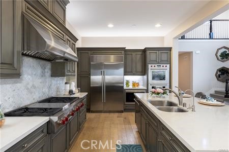 112 Gardenview Irvine, CA 92618 - Photo 8 of 33 a kitchen with stainless steel appliances granite countertop a sink stove and refrigerator