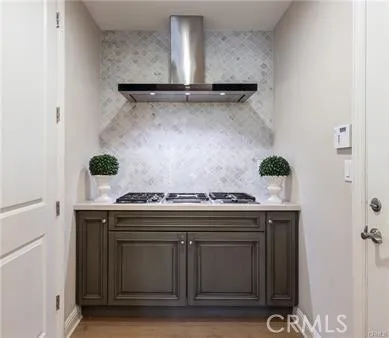 a stove top oven sitting inside of a kitchen