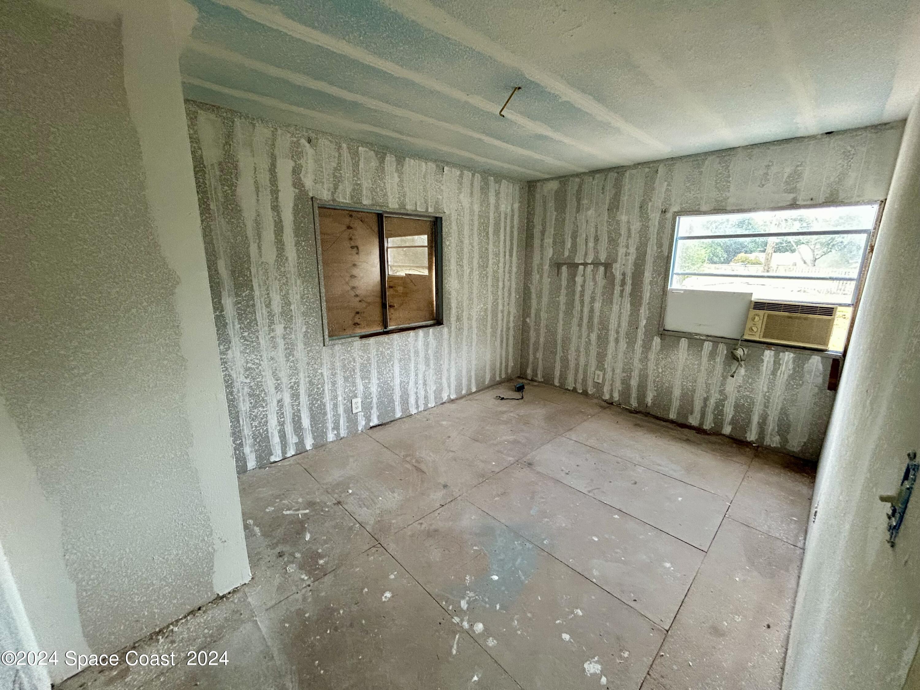 326 Iris Street Cocoa, FL 32927 - Photo 11 of 46 a view of entryway with wooden floor