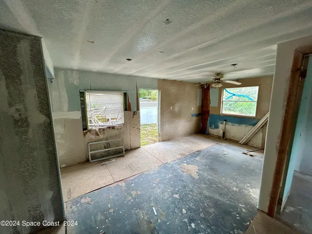 a view of a hallway with a window