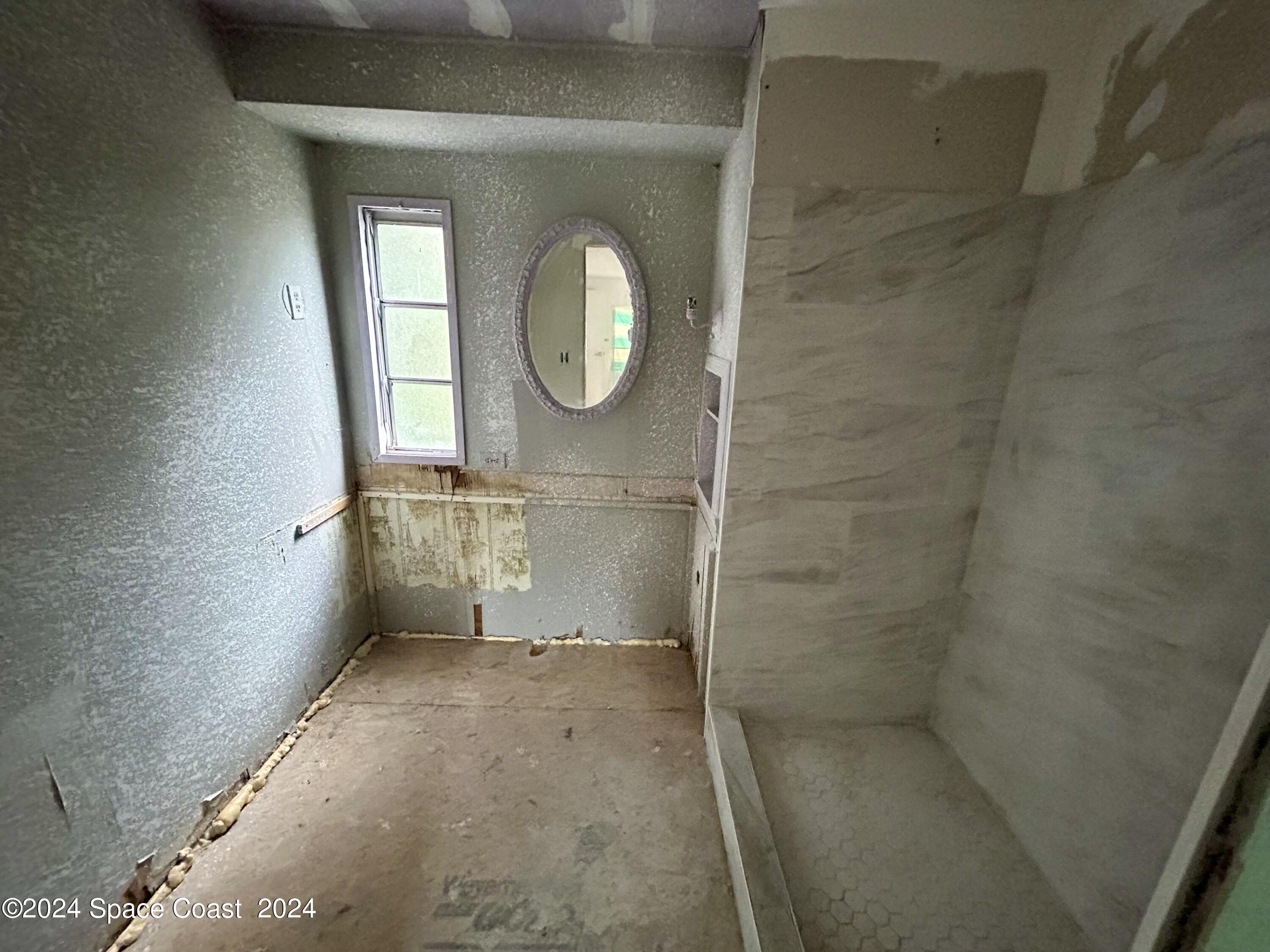 326 Iris Street Cocoa, FL 32927 - Photo 14 of 46 view of a bathroom with a sink and a mirror