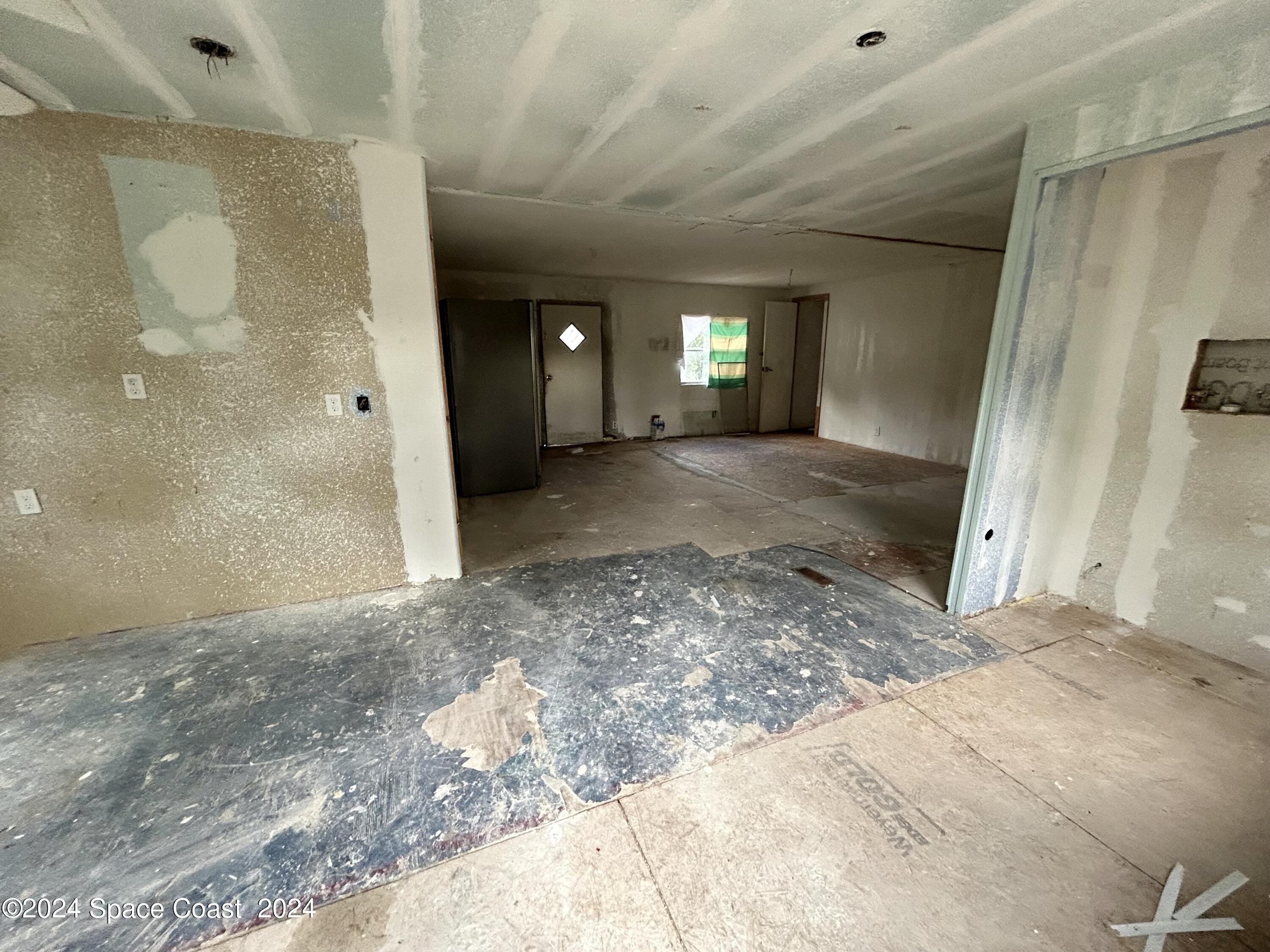 326 Iris Street Cocoa, FL 32927 - Photo 15 of 46 a view of a hallway with a window
