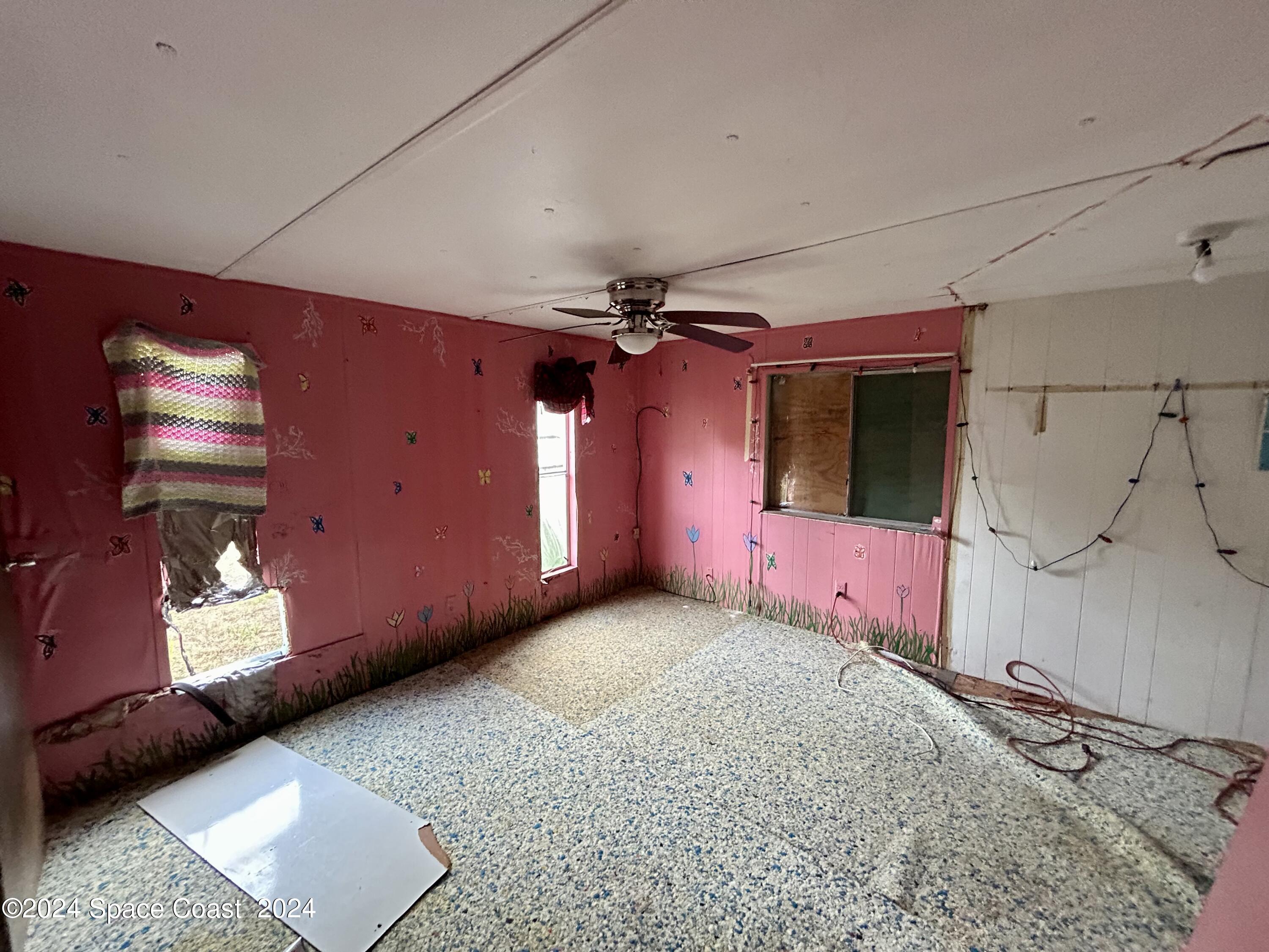 326 Iris Street Cocoa, FL 32927 - Photo 17 of 46 a view of a livingroom with a flat screen tv