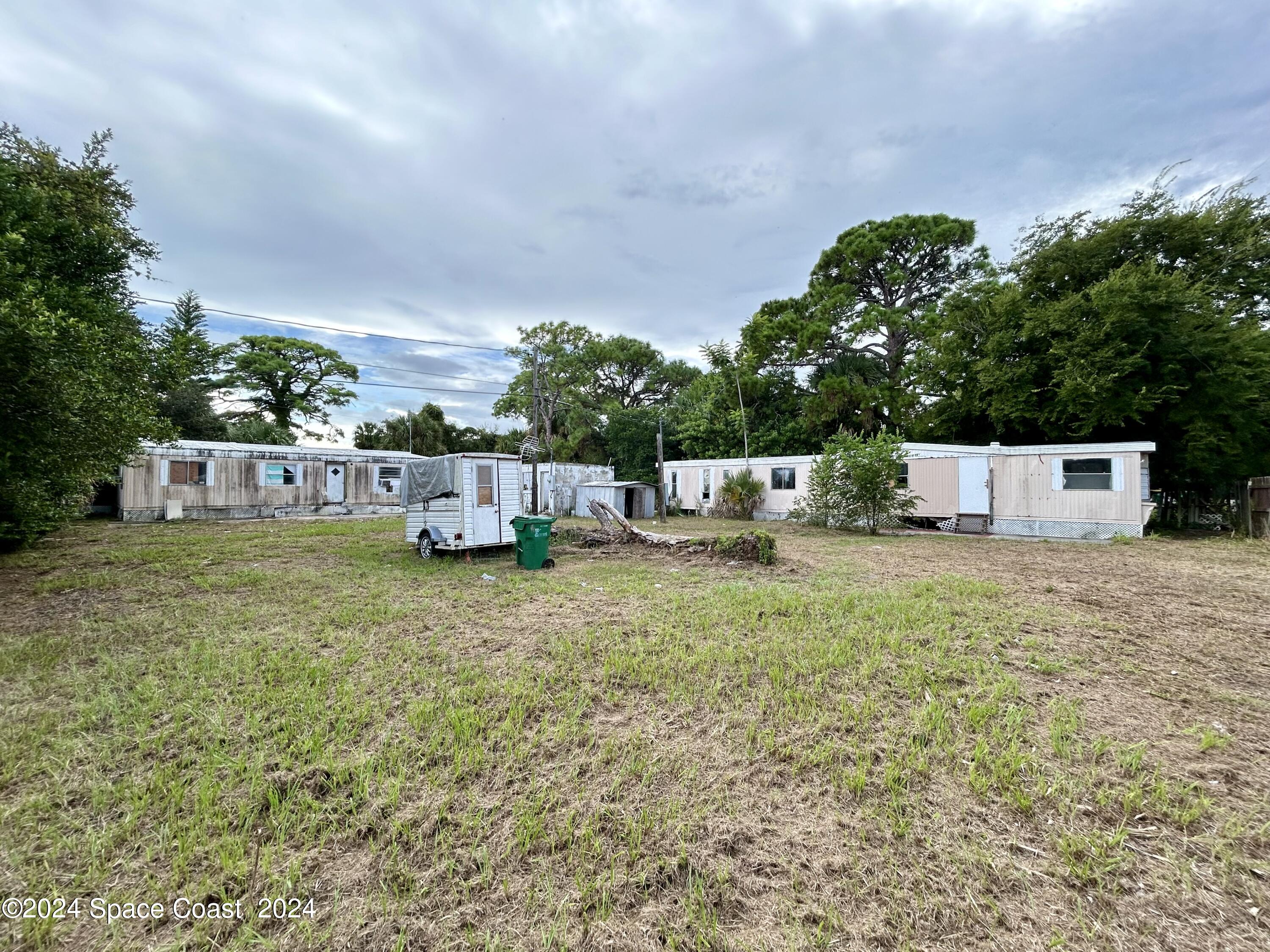 326 Iris Street Cocoa, FL 32927 - Photo 2 of 46 a front view of a house with a garden