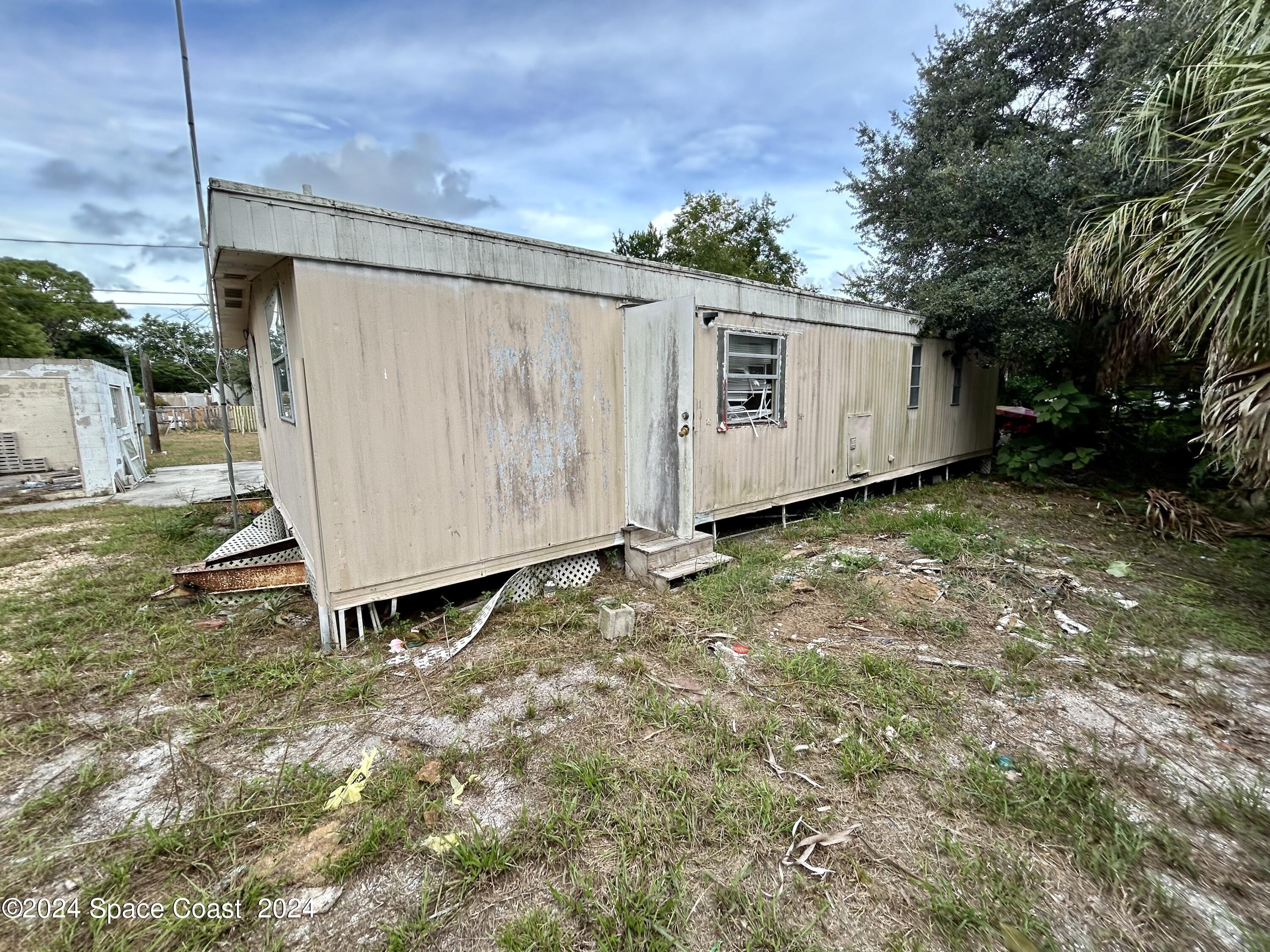326 Iris Street Cocoa, FL 32927 - Photo 33 of 46 a view of a back yard of the house