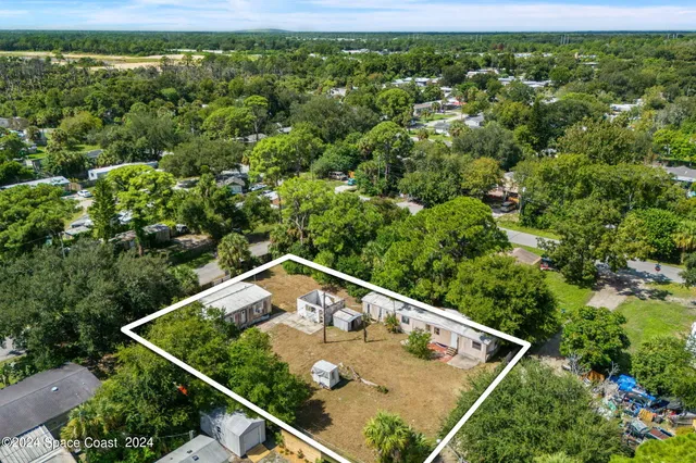 a view of a backyard with trees