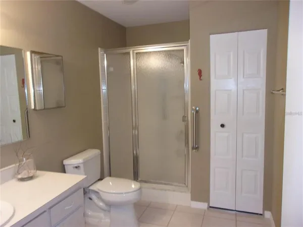 a bathroom with a toilet sink and shower