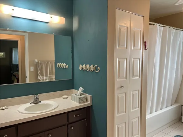 a bathroom with a sink double vanity and a mirror