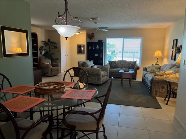 a dining room with furniture and window