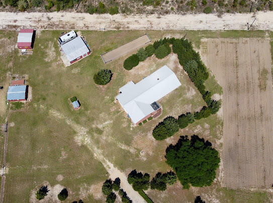 an aerial view of a house with outdoor space