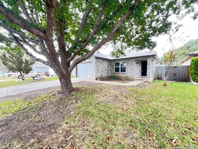 a house with trees in front of it