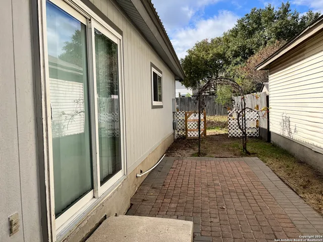 a view of a back yard from a balcony