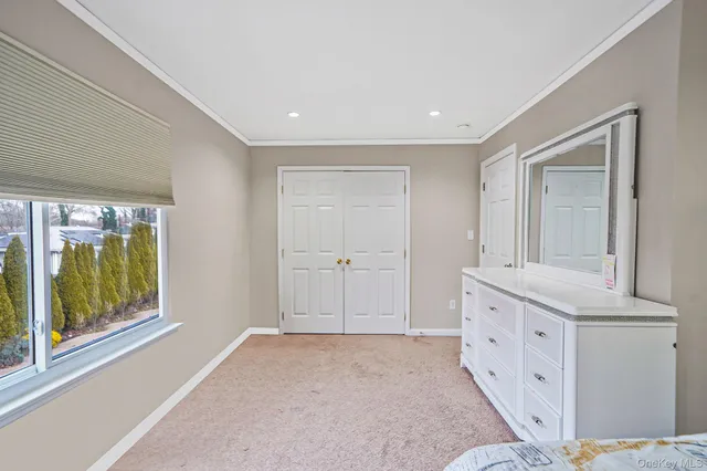 a bedroom with a bed and dresser