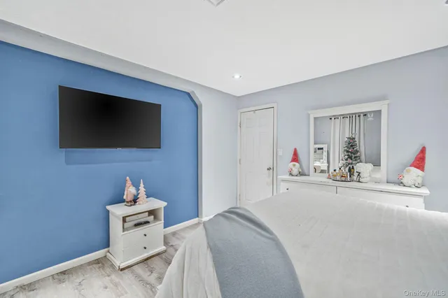 a bedroom with a bed and a dresser