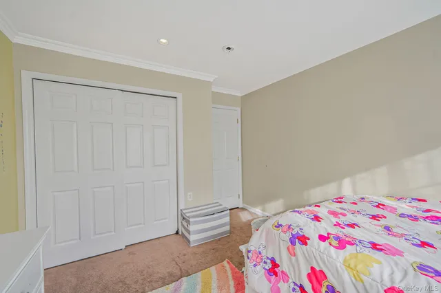 a bathroom with a toilet a sink and a mirror