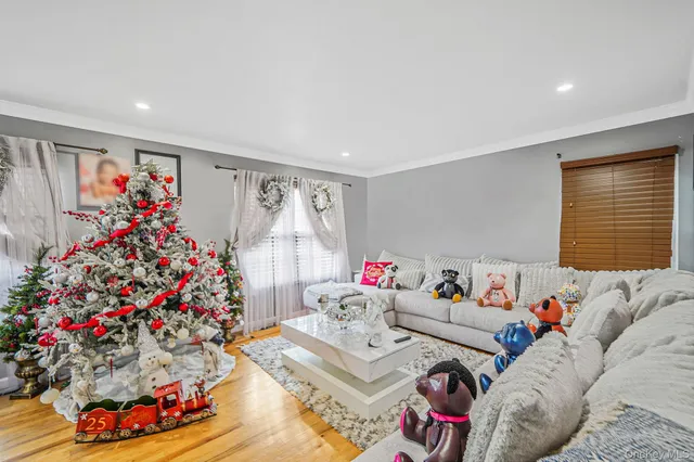 a living room with furniture and flowers