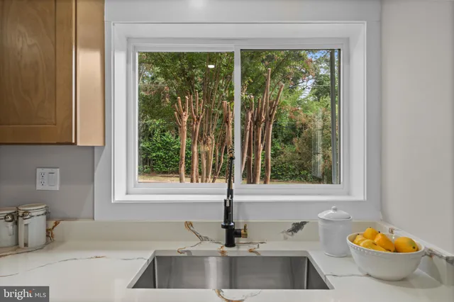 a kitchen with a sink and a window