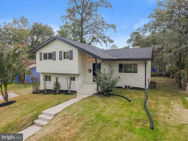 a view of a house with a yard patio and a yard
