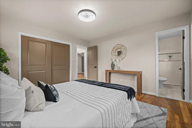 a bedroom with a bed and a closet