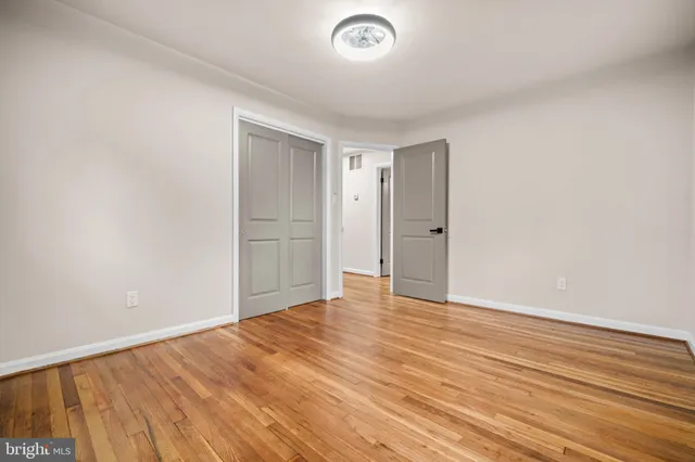 a view of room with wooden floor