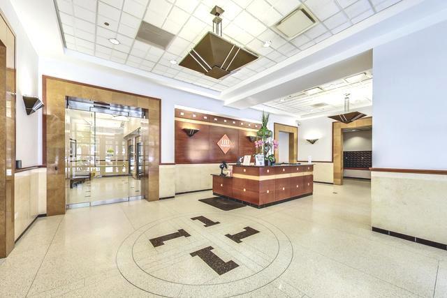 1111 South Wabash Avenue, Unit 706 Chicago, IL 60605 - Photo 2 of 19 a living room with furniture and a large window