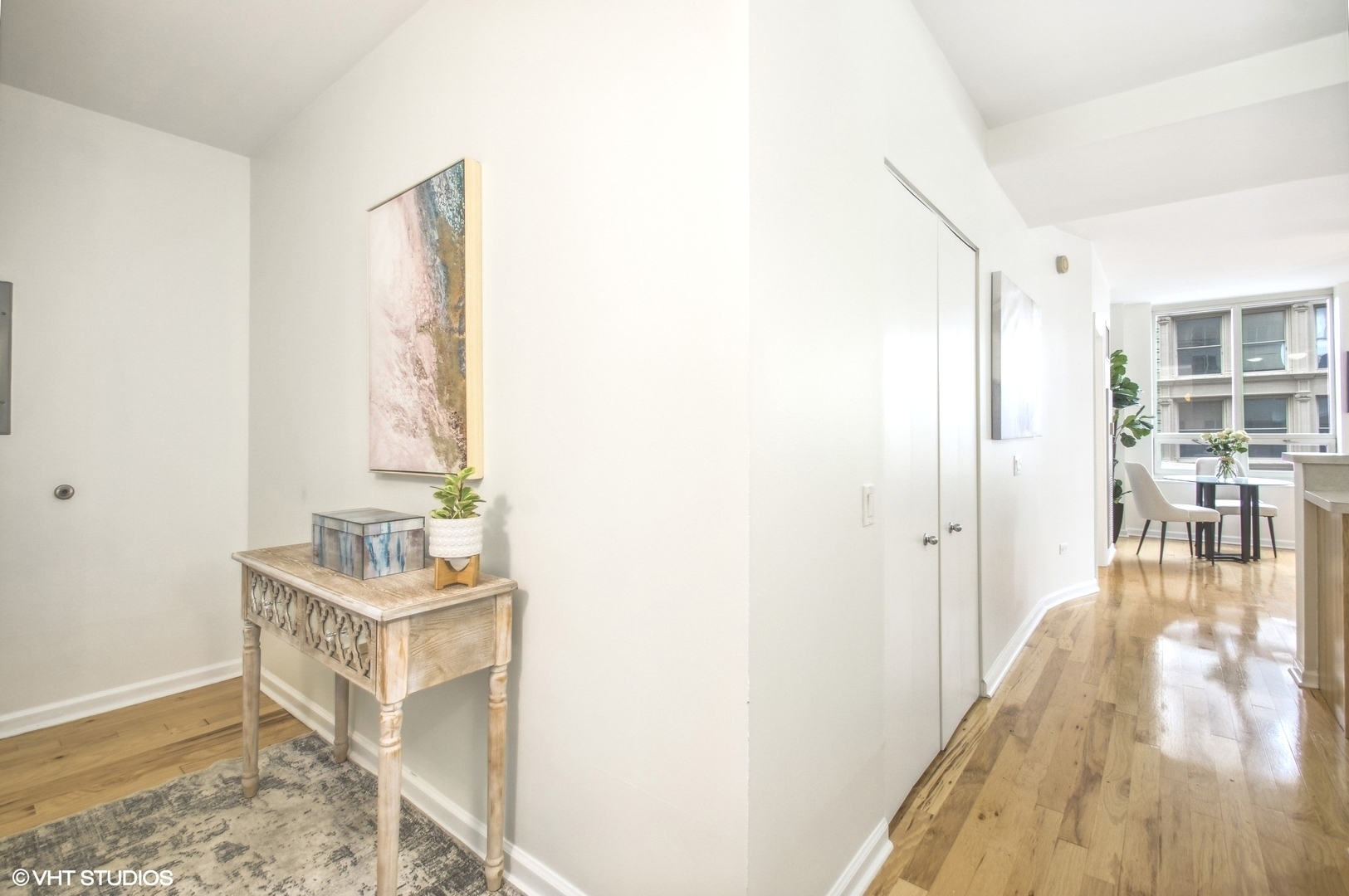 1111 South Wabash Avenue, Unit 706 Chicago, IL 60605 - Photo 3 of 19 a view of hallway with wooden floor