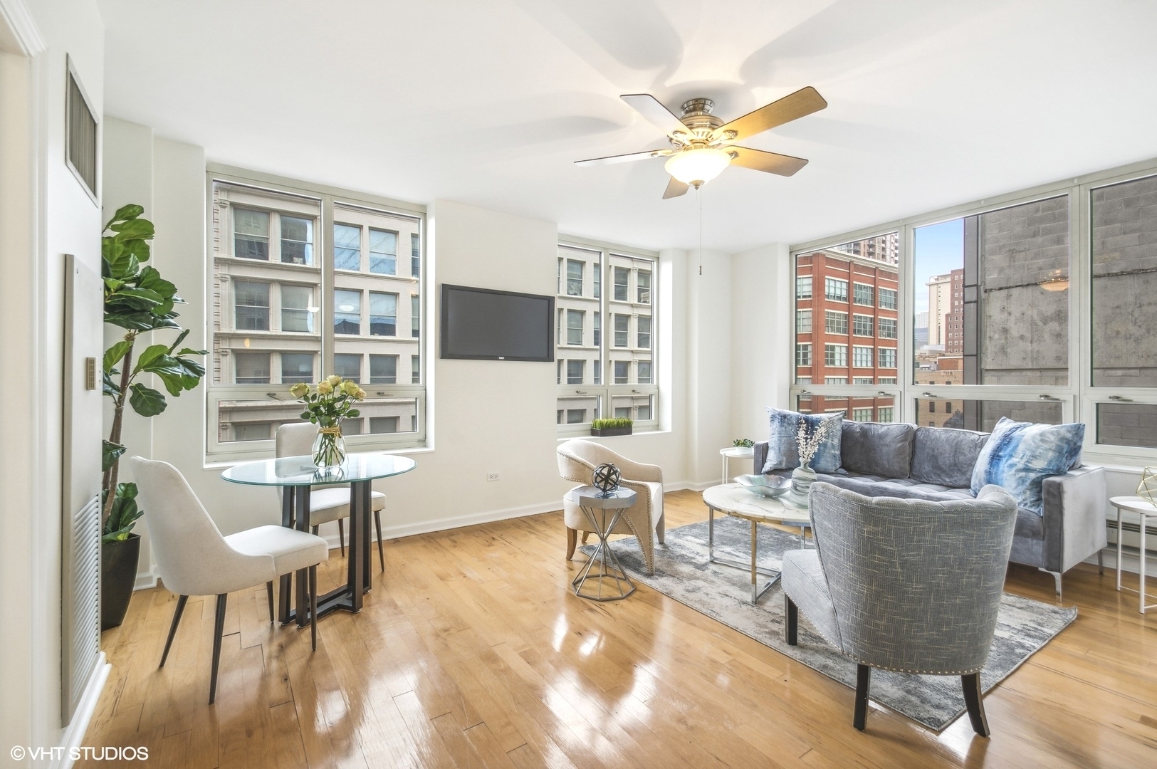 1111 South Wabash Avenue, Unit 706 Chicago, IL 60605 - Photo 4 of 19 a living room with fireplace furniture and a large window