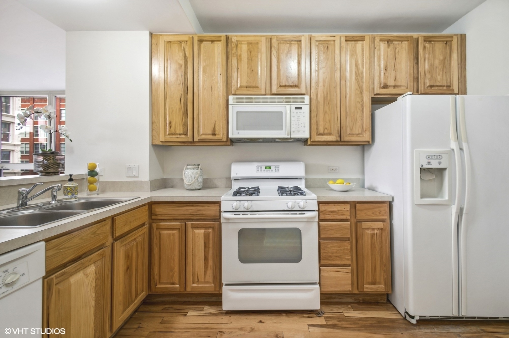 1111 South Wabash Avenue, Unit 706 Chicago, IL 60605 - Photo 9 of 19 a kitchen with a sink stove and refrigerator